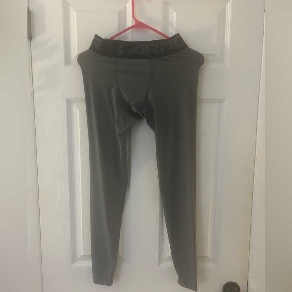 Two pairs of Under Armour Kids Gray and Black Performance Compression Leggings